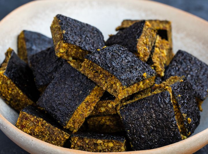 Raw vegan Thai nori bites in a white bowl