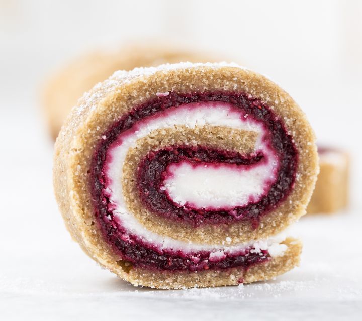 Raw vegan Swiss roll on a white background