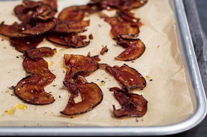 Eggplant bacon on a tray lined with parchment paper