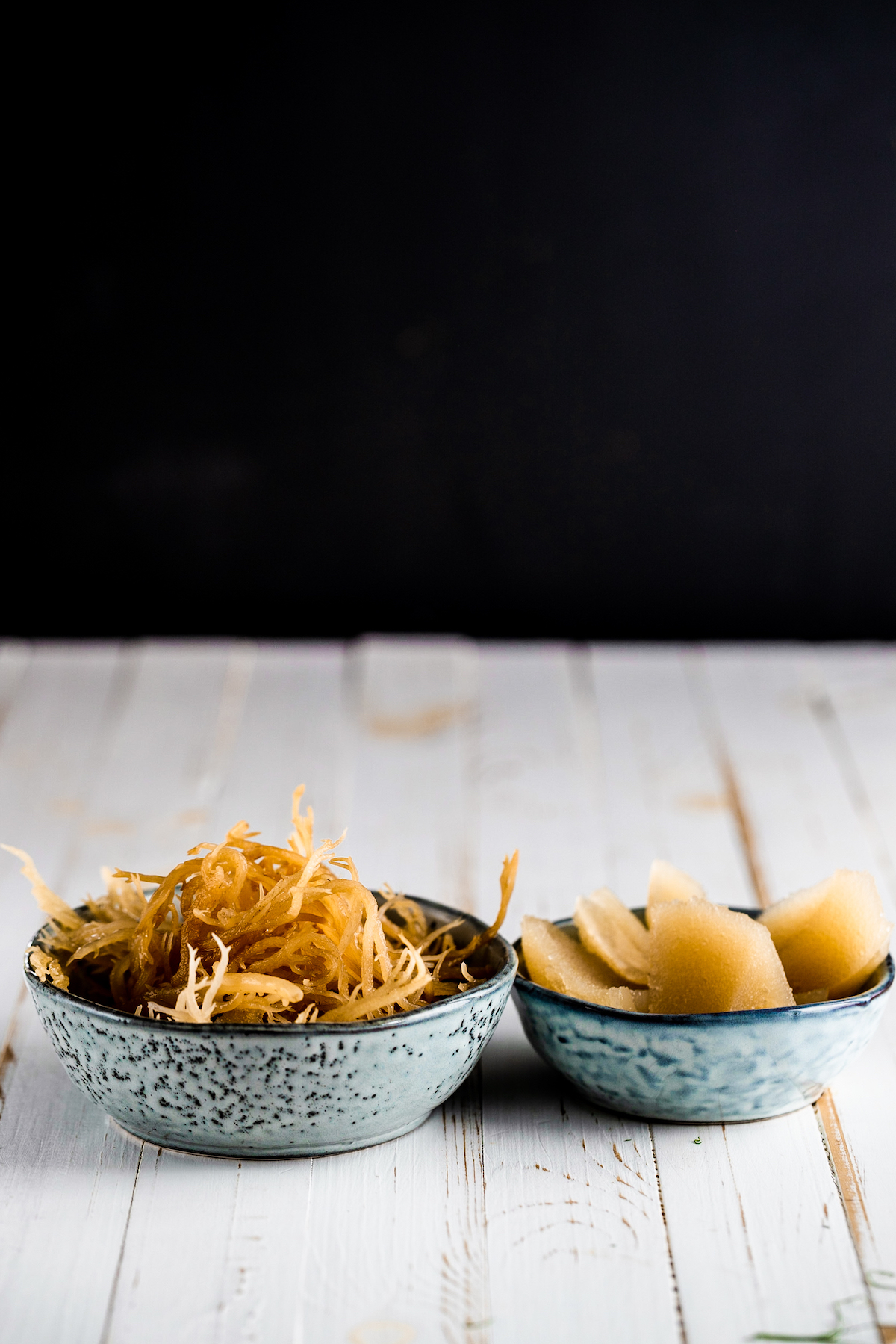 Soaked Irish moss and Irish moss gel in bowls on a white board