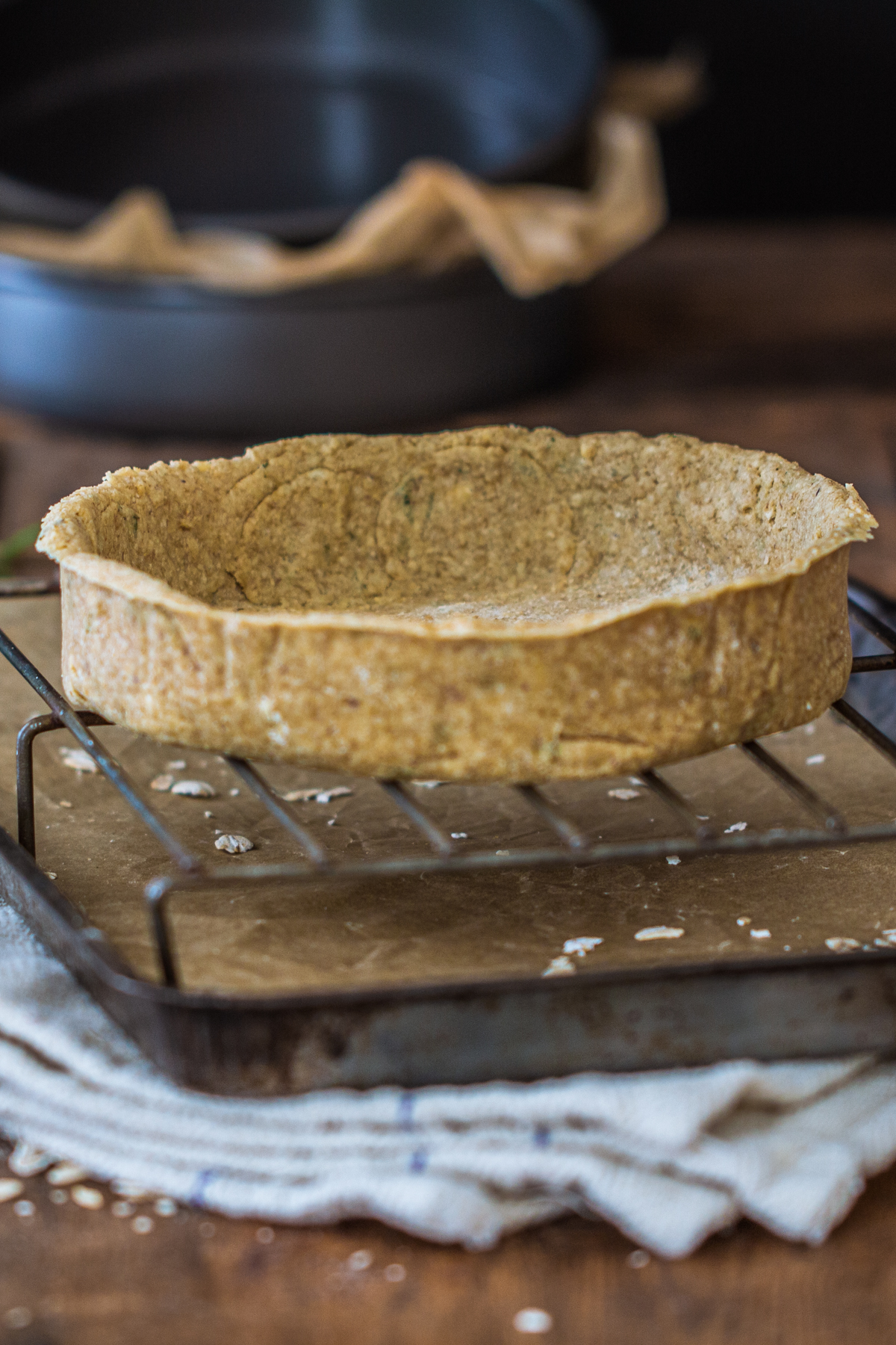Raw flaky pie crust on a cooling rack