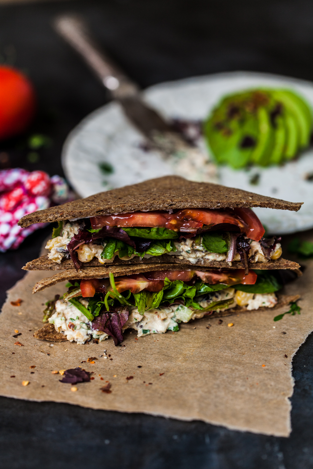 Raw sandwich made with dehydrator chia seed bread on brown paper