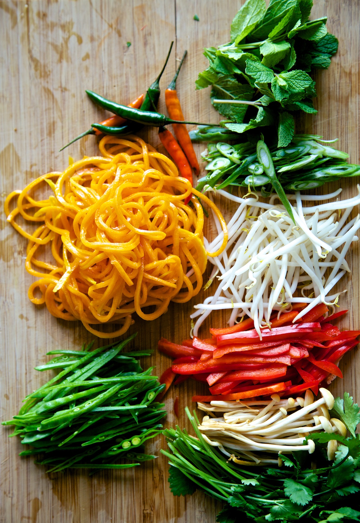 Pad Thai chopped and ready to use on a wooden chopping board