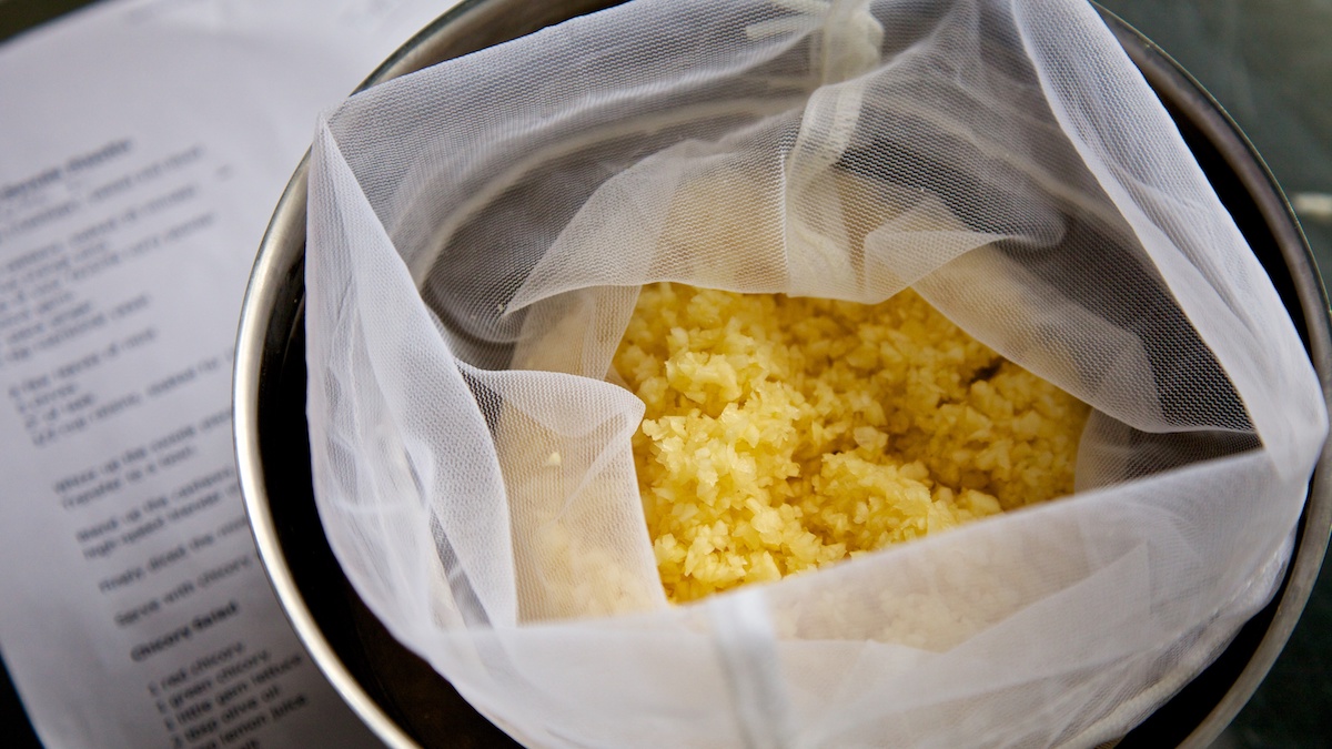 Swede rice in a nut milk bag in a silver bowl