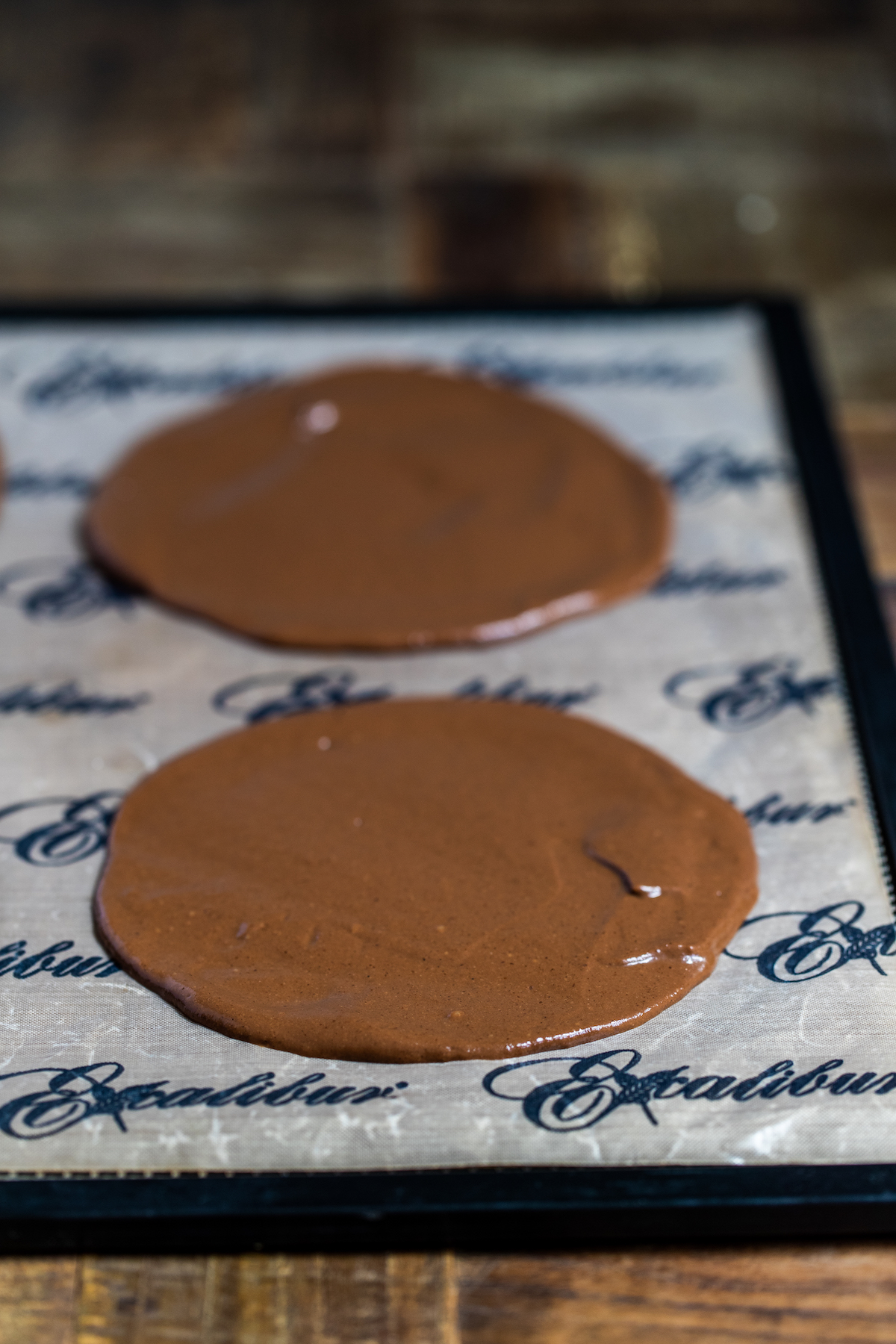 2 cacao crepes spread on a nonstick dehydrator sheet 