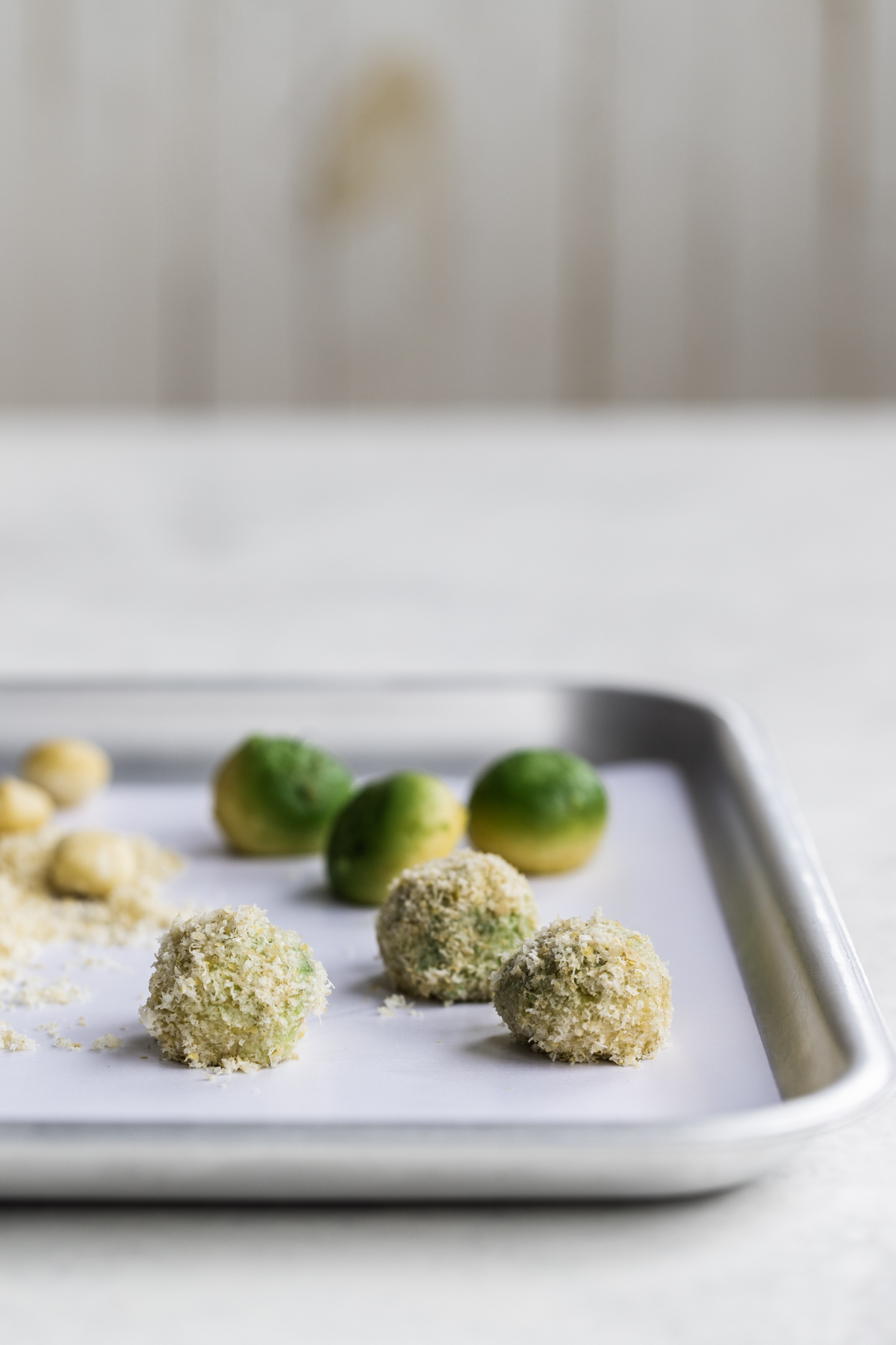 Mozzacado balls on a silver tray and white background