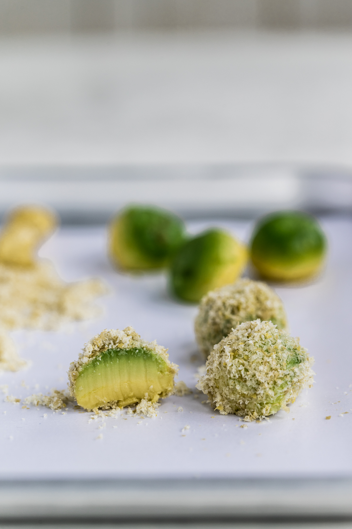 Mozzacado balls on a silver tray and white background