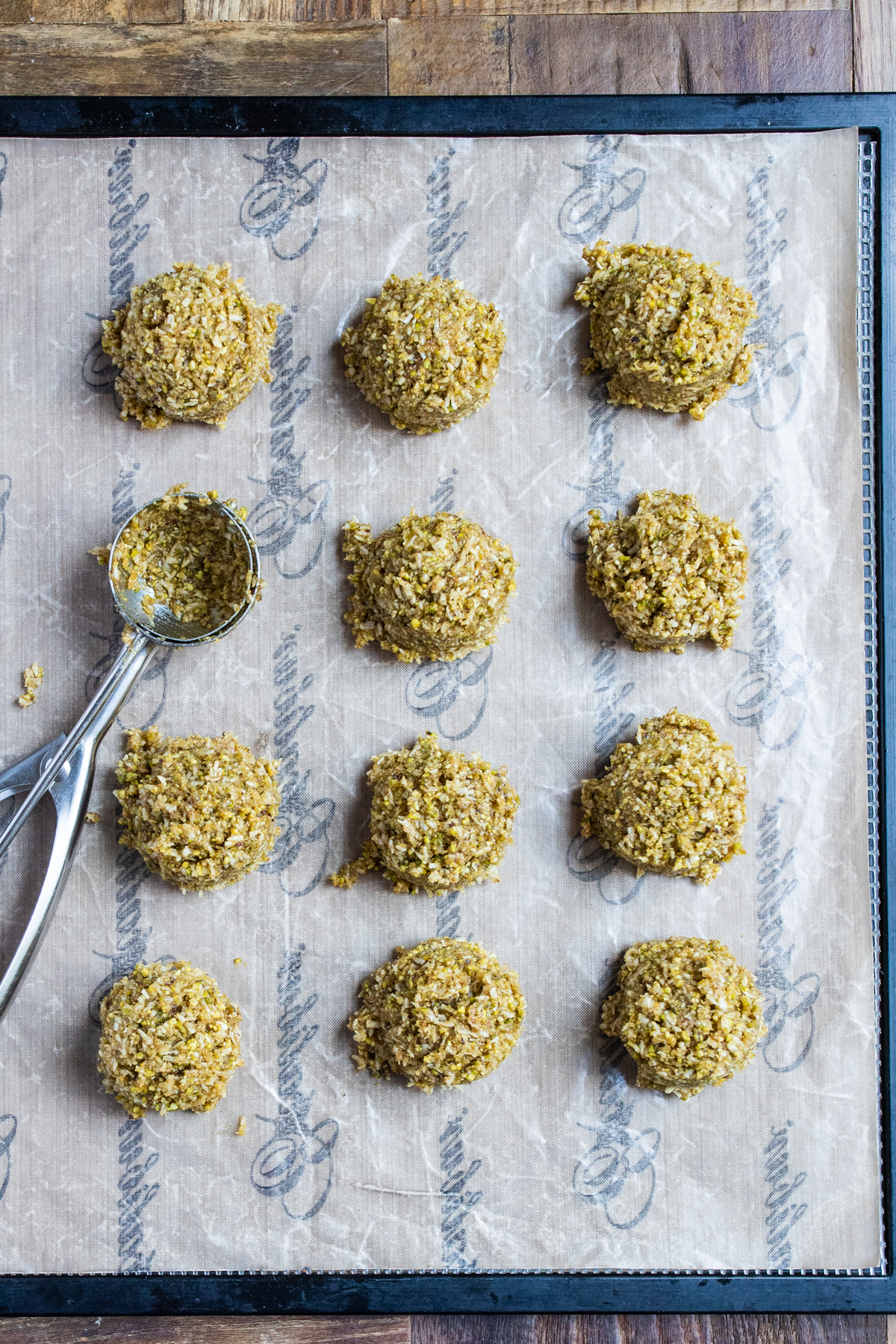 Overhead shot of Pistachio Five Spice Macaroons on a dehydrator tray