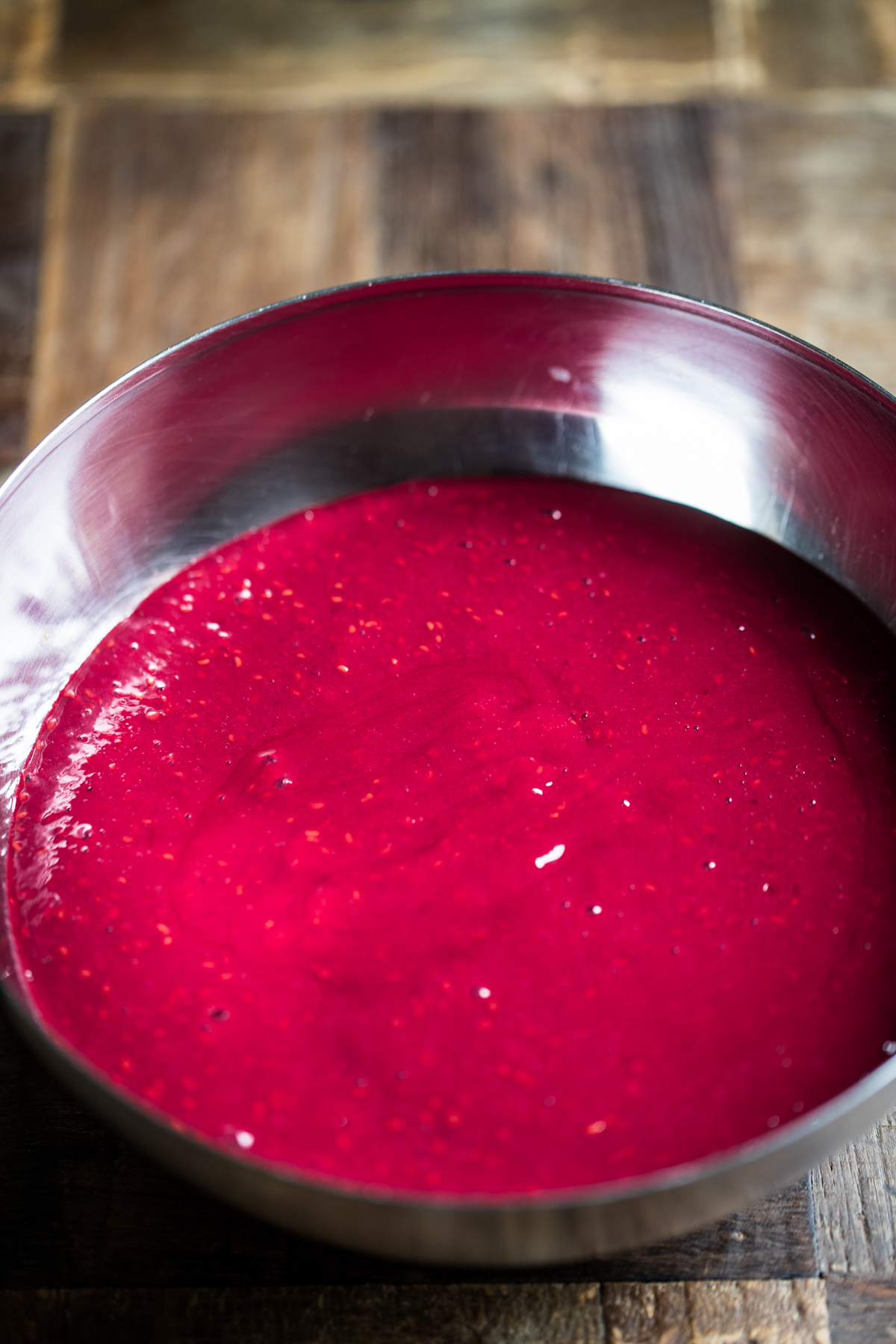 Blended raspberries in a silver bowl