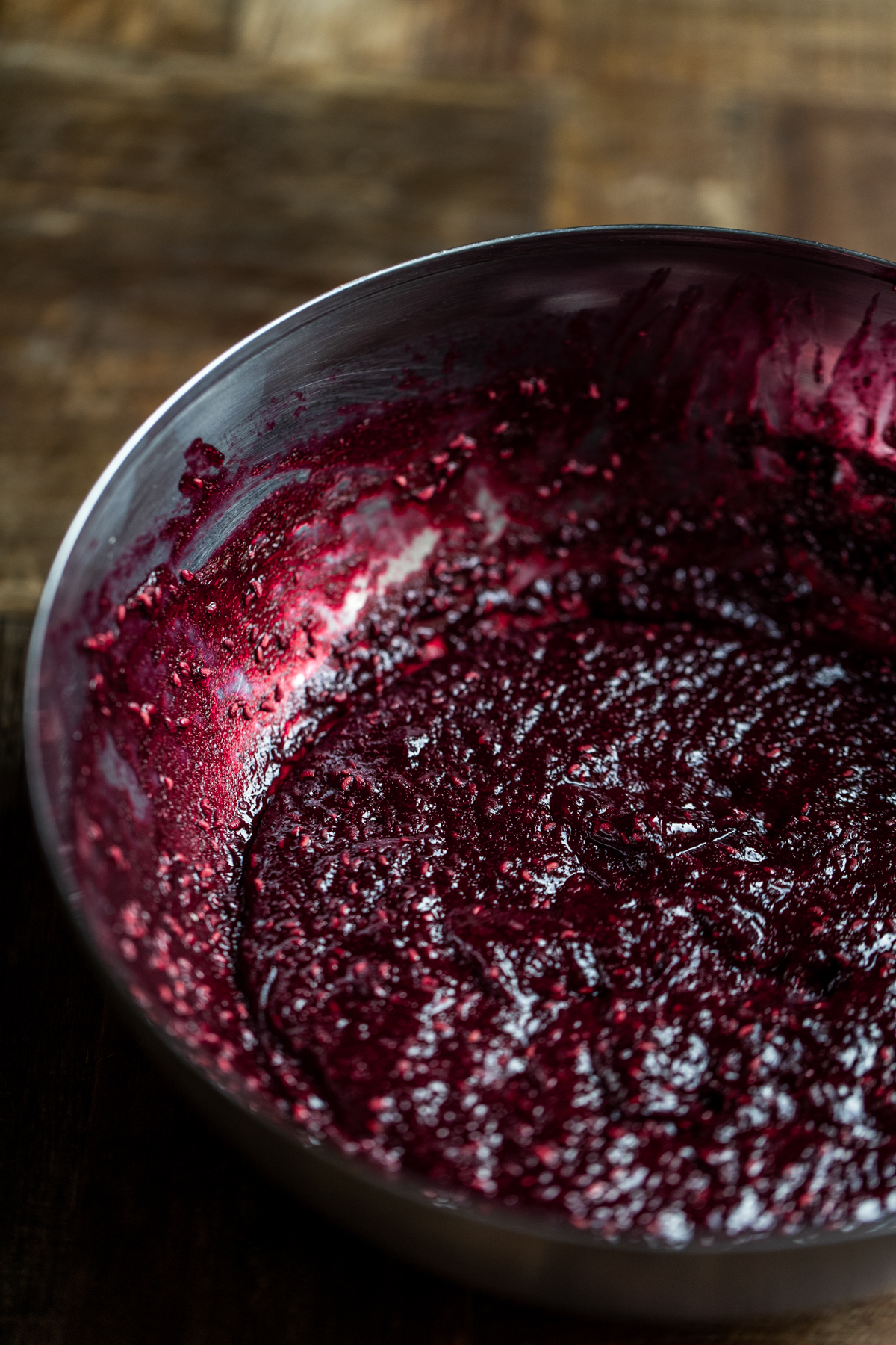 Dehydrated raspberry jam in a silver bowl