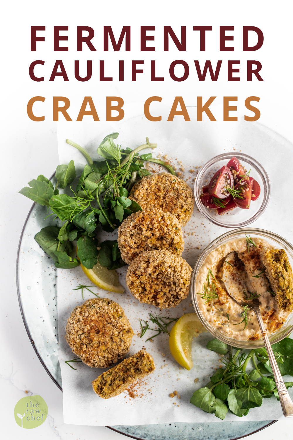 Fermented cauliflower crab cakes with horseradish dipping sauce with watercress on a white background